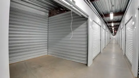 A row of storage units with one door open, showcasing the clean interior.
